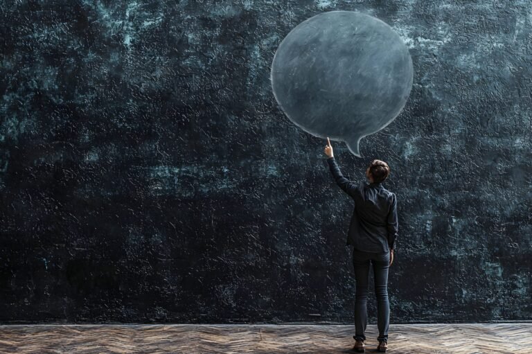 Silhouette of solitary person holding umbrella standing under the heavy rain at night Dramatic moody and atmospheric landscape with dark gloomy and stormy weather